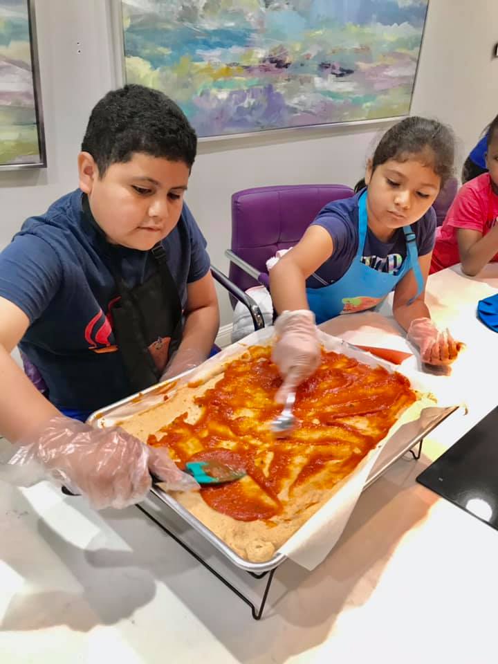 Kids prepping dough at camp