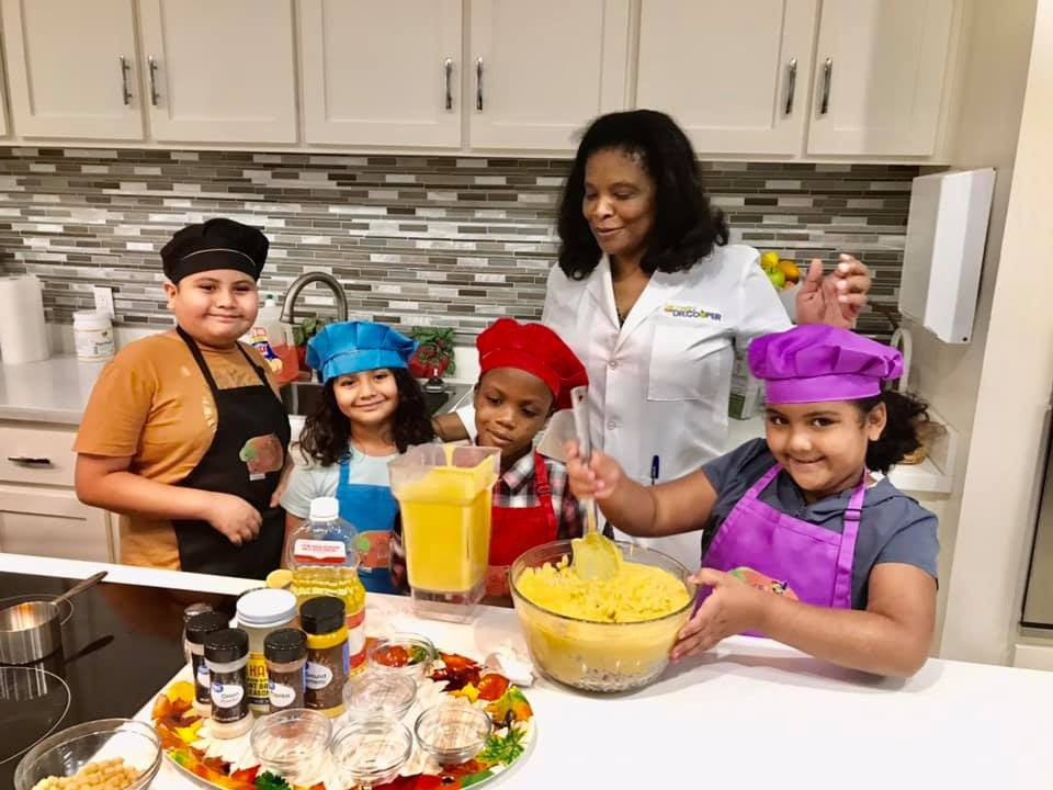 Children cooking with Dr. Cooper